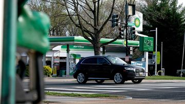 A vehicle drives past a BP gas station.