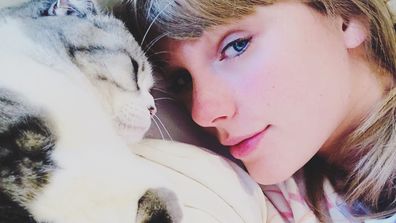 Taylor Swift and her pet cat Olivia Benson.