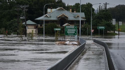 The Windsor Bridge partly submerged under rising floodwaters along the Hawkesbury River, north of Sydney, NSW.