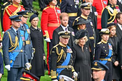 Prince William, Prince of Wales, Prince Harry, Duke of Sussex, Meghan, Duchess of Sussex, King Charles III, Camilla, Queen Consort, Princess Anne, Princess Royal and Princess Beatrice observe the coffin of Queen Elizabeth II as it is transferred from the gun carriage to the hearse at Wellington Arch following the State Funeral of Queen Elizabeth II at Westminster Abbey on September 19, 2022 in London