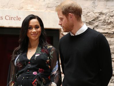 A sweet photo has emerged showing Prince Harry gazing at his wife, Meghan's, baby bump during a visit to Bristol.