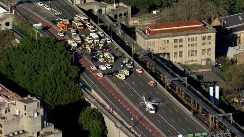 Rescue helicopter lands on Sydney Harbour Bridge after a fatal multi-vehicle crash. August 27, 2020.