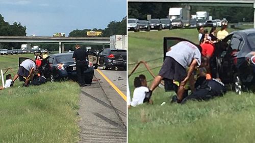 Police officer cradles boy injured in car accident