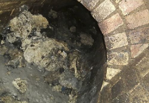 In this undated handout photo issued by Thames Water today, part of a fatberg inside a sewer in Whitechapel, London, can be seen. (AAP)
