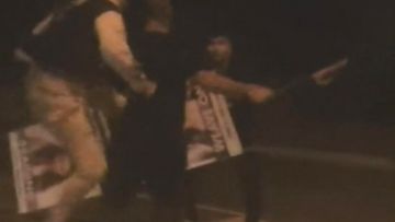 A driver has been kicked in the back and smashed with a sign in a punch up on an Adelaide street