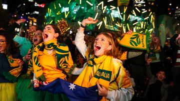 Australian fans celebrate as the Matildas beat Denmark