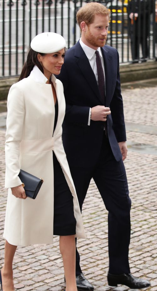 Meghan wore a cream coat and navy dress by Amanda Wakeley. Picture: PA/AAP