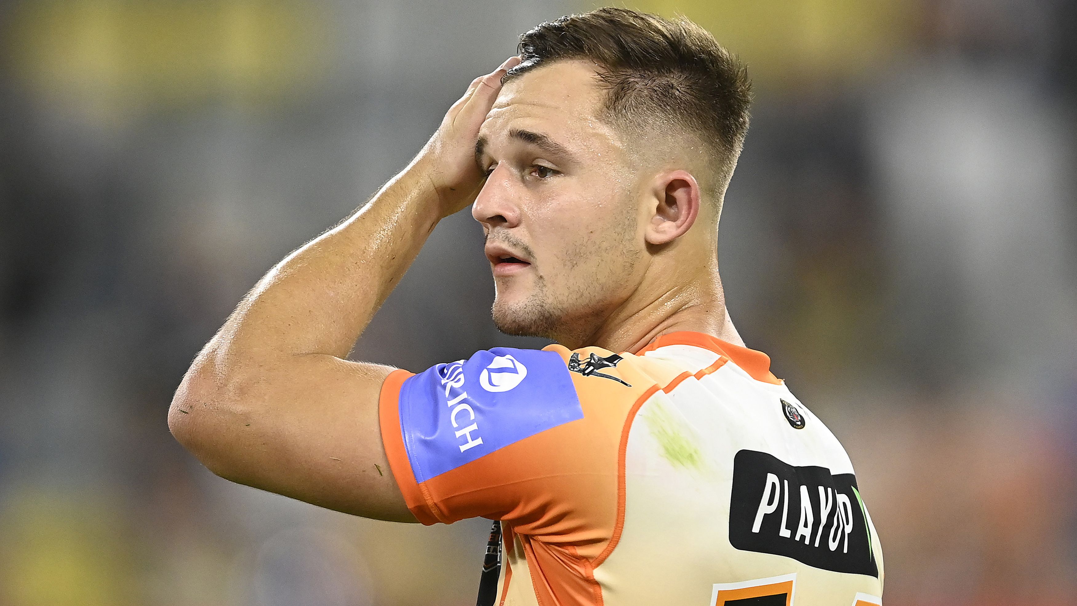 Jake Simpkin of the Tigers looks dejected after losing  the round 12 NRL match between North Queensland Cowboys and Wests Tigers at Qld Country Bank Stadium, on May 24, 2024, in Townsville, Australia. (Photo by Ian Hitchcock/Getty Images)