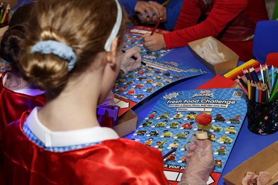 Primary school students attend the Coles Super Hero Builders collectables campaign launch