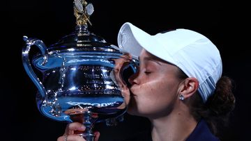 MELBOURNE, AUSTRALIA - JANUARY 29: Ashleigh Barty of Australia kisses the Daphne Akhurst Memorial Cup after winning her Womens Singles Final match against Danielle Collins of United States during day 13 of the 2022 Australian Open at Melbourne Park on January 29, 2022 in Melbourne, Australia. (Photo by Clive Brunskill/Getty Images)