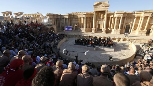 The Russian Mariinsky Theater Orchestra, conducted by Valery Gergiev performs during a concert in the Palmyra amphitheater in Palmyra on May 5, 2016. (AAP)