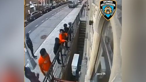 The group of teens are seen hanging around outside the Volkan Shul synagogue while people attend Sabbath inside.