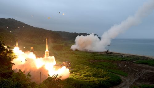 South Korea's Hyunmoo II Missile system, left, and a U.S. Army Tactical Missile System, right, fire missiles during last year's joint military exercises. Picture: AP