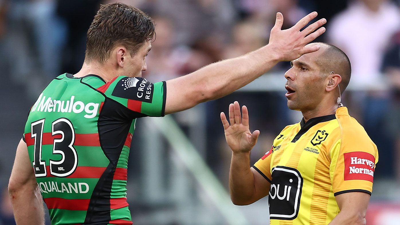 Referee Ashley Klein explains one of his sin bin decisions to Souths captain Cameron Murray