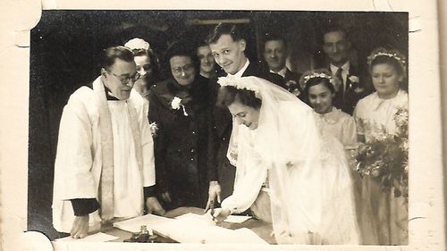 Mr Cooper on his wedding day with his bride May, who he met at the pictures when she was 14.