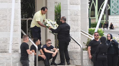 A wreath is delivered to the slain bikie boss' funeral at Al-Zahra mosque in Arncliffe. (AAP)