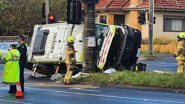 Three people hospitalised after an ambulance rollover in Preston Victoria. 