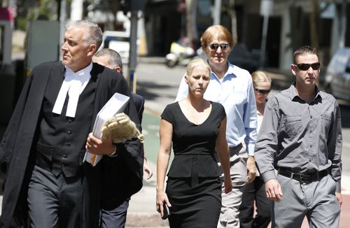 Heidi Strbak (centre) arrives with her lawyer and family members at the Supreme Court, Brisbane, today. (AAP)