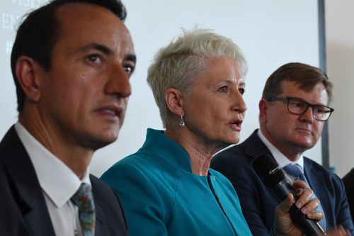 Kerryn Phelps, centre, with David Sharma, left, and Labor's Tim Murray in a debate at Bondi Surf Club on Monday.