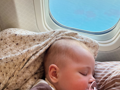 Amy on a flight with her daughter when she was a baby