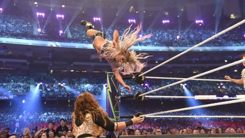 Alexa Bliss flying high before crashing into Nia Jax at Wrestlemania. Picture: Supplied