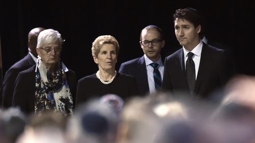 Prime Minister Justin Trudeau, right, Ontario Premier Kathleen Wynne, centre, arrive at the memorial service for Apotex billionaire couple Barry and Honey Sherman in Mississauga, Ontario on Thursday, December 21, 2017. 