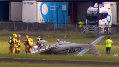 A light plane has crashed and flipped on the runway at Bankstown Airport.