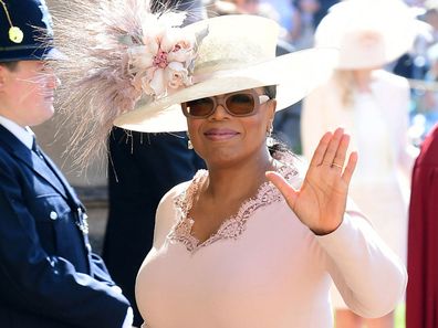Oprah Winfrey waves as she arrives at St George's Chapel at Windsor Castle the wedding ceremony of Prince Harry and Meghan Markle at St. George's Chapel in Windsor Castle in Windsor, near London, England, Saturday, May 19, 2018.
