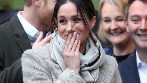 Meghan Markle appeared a little overwhelmed as the crowds cheered for the couple. (Getty)