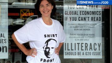 Avid Readers bookstore co-owner Fiona Stager wearing a Vladimir Putin parody t-shirt in Brisbane. (AAP)