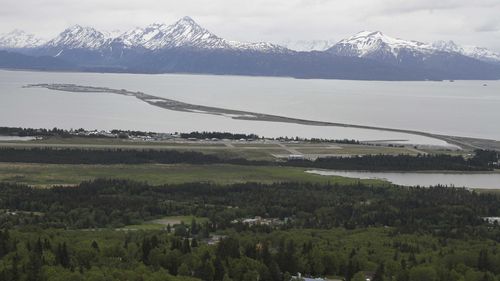 Homer, Alaska, and the Homer Spit, jutting out into Kachemak Bay, is seen on June 9, 2021. Alaska State Troopers say a 70-year-old Homer man attempting to take photos of newborn moose calves was attacked and killed by the calves' mother in Homer on Sunday, May 19, 2024. 