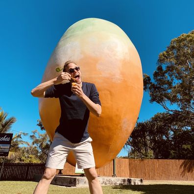Tim at the big mangoe in Bowen Qld with their famous mango sorbet.