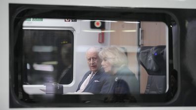 Britain's King Charles III, with Camilla, the Queen Consort board a train on their way to Hamburg from a train station in Berlin, Friday, March 31, 2023. King Charles III arrived Wednesday for a three-day official visit to Germany. (AP Photo/Markus Schreiber, Pool)