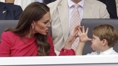 Kate, Duchess of Cambridge, left speaks with Prince Louis, during the Platinum Jubilee Pageant, in London, Sunday June 5, 2022, on the last of four days of celebrations to mark the Platinum Jubilee.  