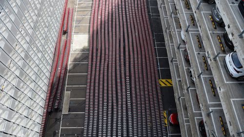 Hundreds of empty luggage trollies are seen stacked at Sydney International Airport in Sydney.