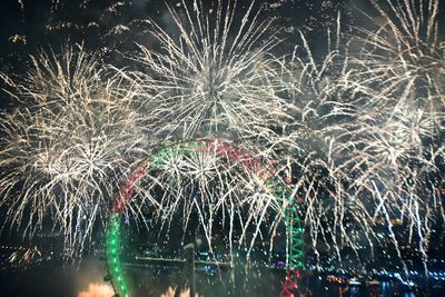 Fireworks light up the sky over the London Eye in central London during the New Year celebrations.