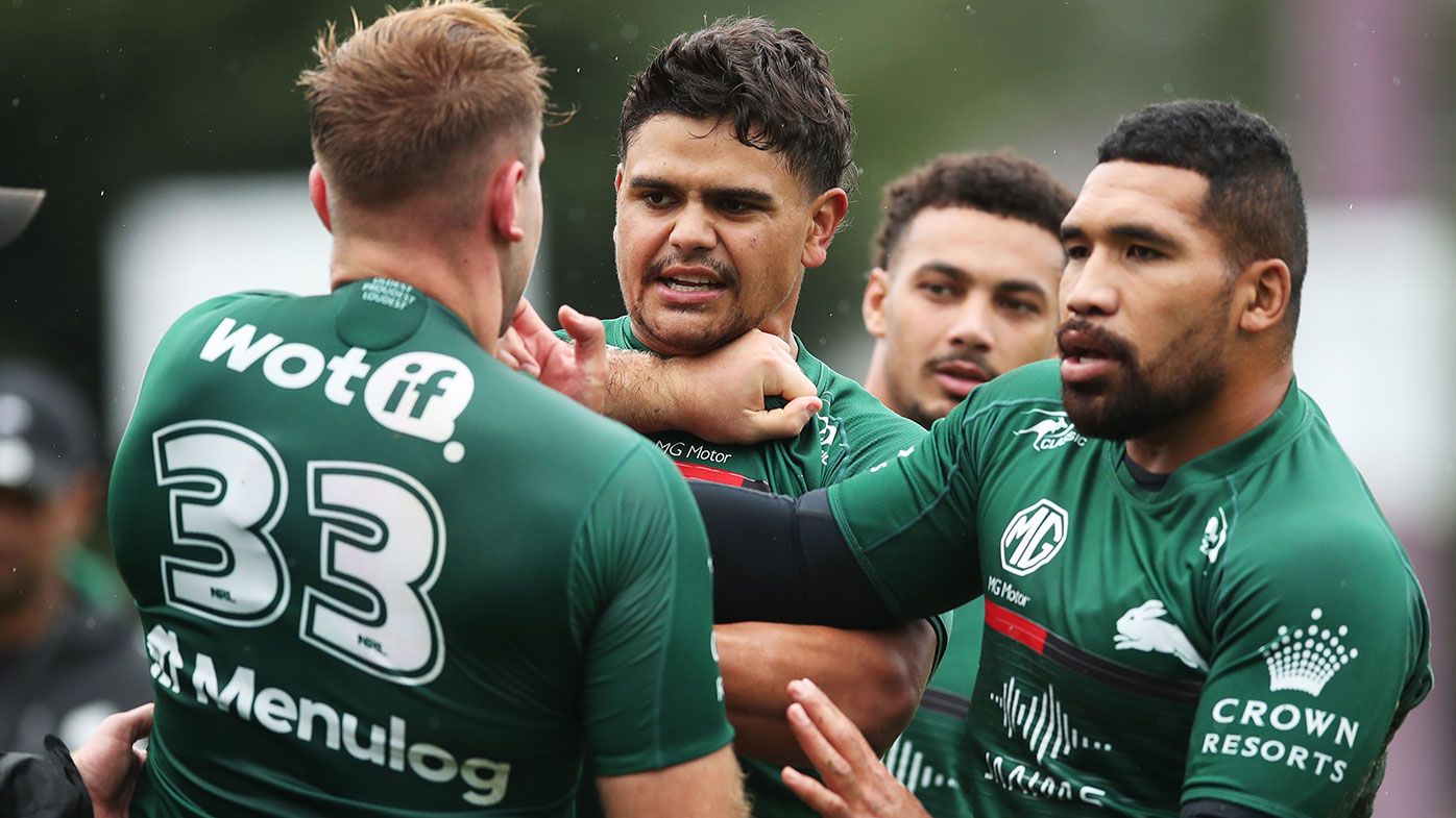 Latrell Mitchell wrestles with Jacob Host during a South Sydney Rabbitohs training session