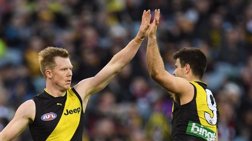 Tigers players Jack Riewoldt (left) and Trent Cotchin react during the Round 23 AFL match between the Richmond Tigers and the St Kilda Saints at the MCG. 