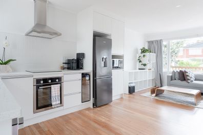 Kitchen with stainless steel fridge