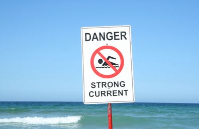 Warning Sign "Danger Strong Current" at the beach.