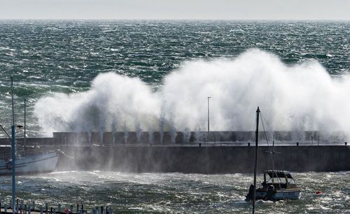 Wild waves blast over Mornington Pier this afternoon. Picture: Mark Spencer