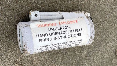 A photo of the Simulator Hand Grenade M116A on beach.