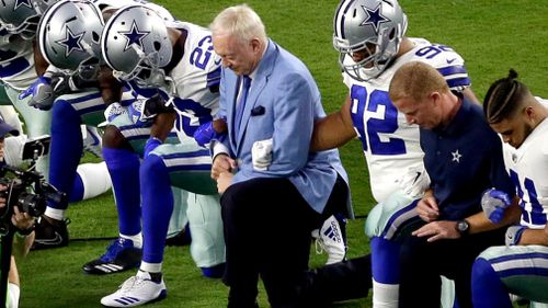 The Dallas Cowboys knelt before the US anthem at their game. (AAP)