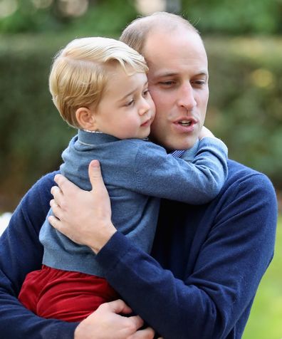Prince William hugging Prince George
