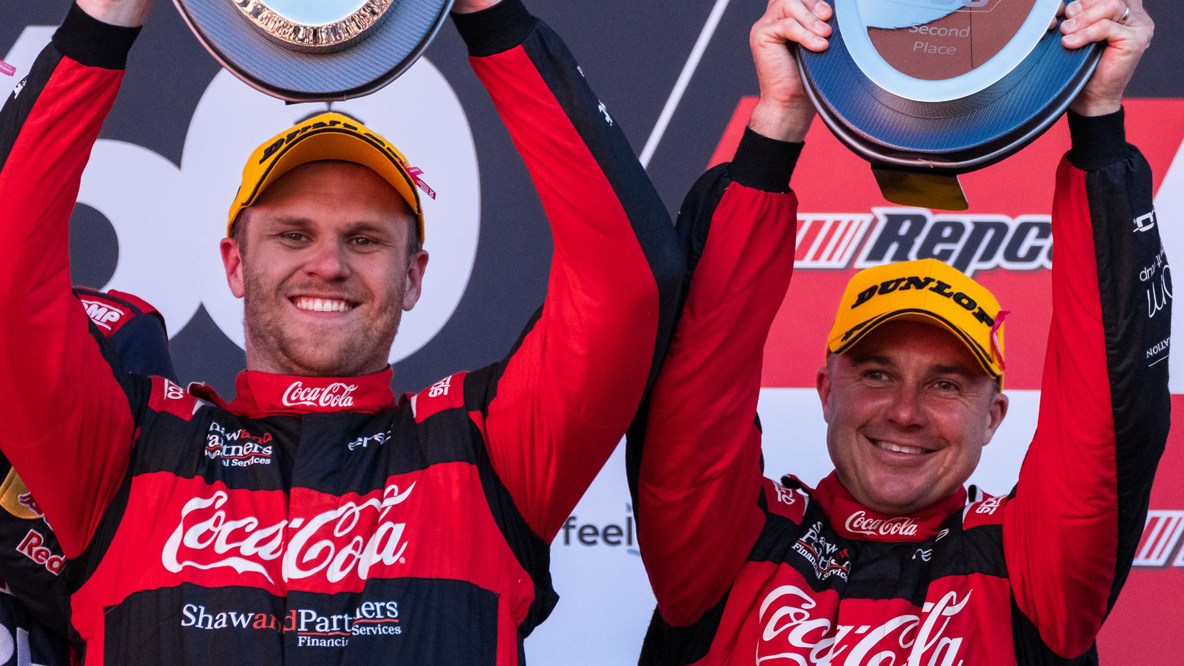 David Russell (right) celebrates with Brodie Kostecki on the podium at the 2023 Bathurst 1000.