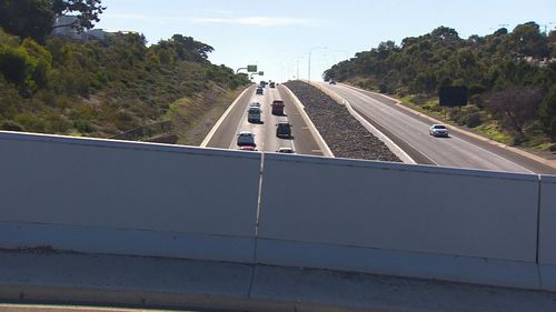 He was driving under the Honeypot Road bridge at 12:30am on Friday morning when his car was pelted with rocks. Picture: 9NEWS