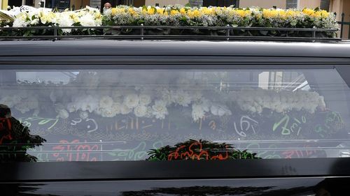 Hawi's hearse was covered in Arabic writing. (AAP)