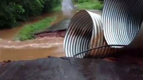 Road is swept away by flood waters in Texas (Facebook/Allen N Laneigh Childers)