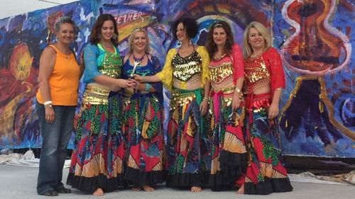 Mrs Orlando (far right) is also part of a belly dancing troupe.