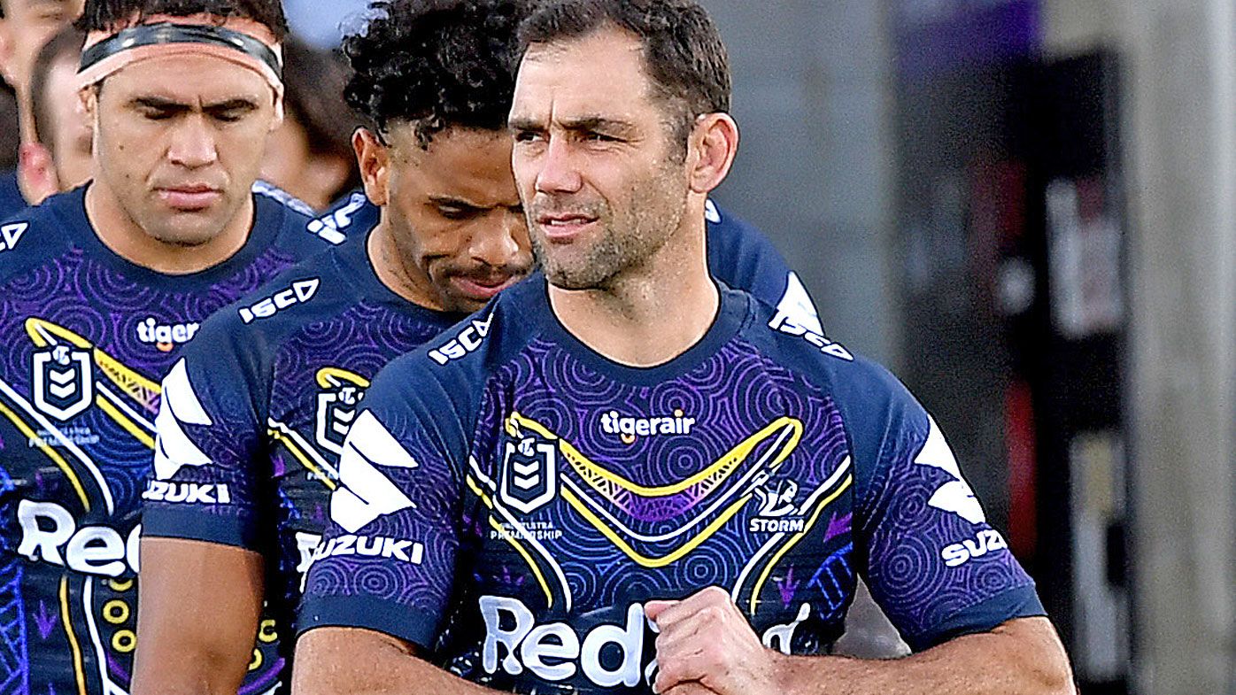 Cameron Smith of the Storm leads his team onto the field